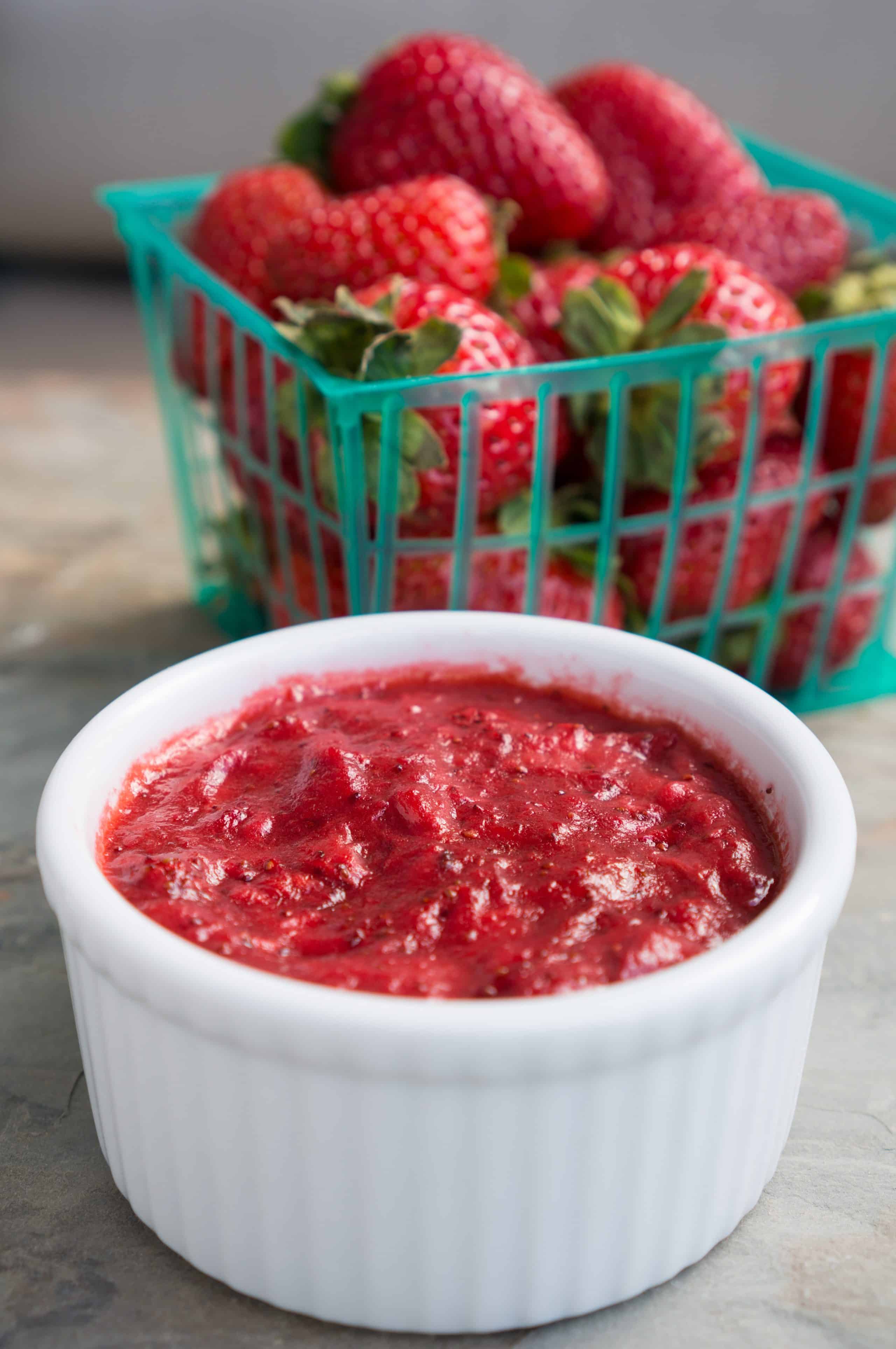 Roasted Strawberry Sauce - This easy 4-ingredient recipe for Roasted Strawberry Sauce uses fresh strawberries, honey, coconut oil, & a squeeze of lemon juice! Slather this sauce on French toast or pancakes, layer it in yogurt parfaits, or enjoy it on ice cream. We love that this real fruit spread is gluten free AND refined sugar free. ♥ | freeyourfork.com