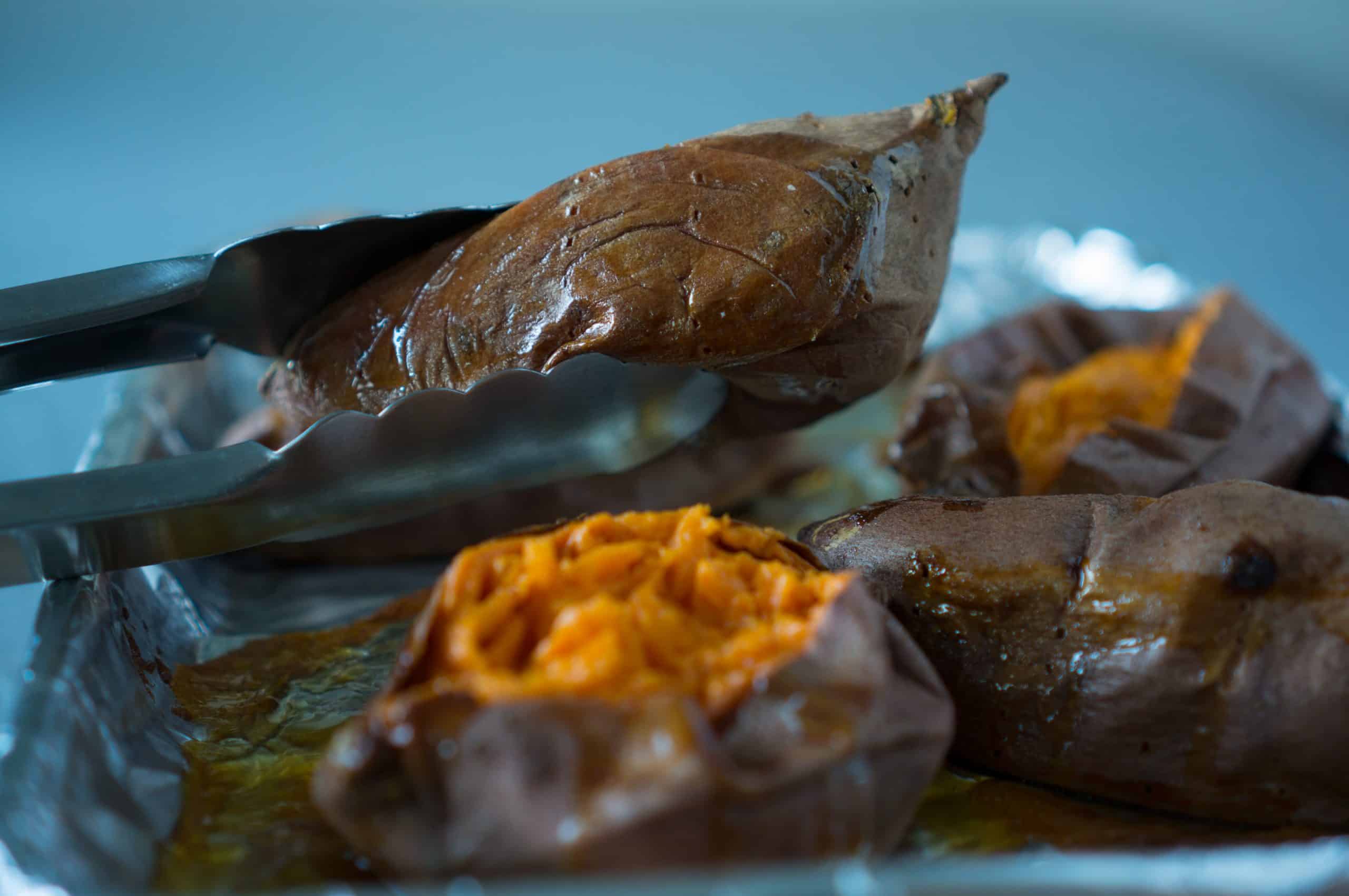 Slow Roasted Sticky Sweet Potatoes - We love this simple, vegan recipe for Slow Roasted Sticky Sweet Potatoes! Just 2 ingredients (olive oil + sweet potatoes) & a hot oven are all you need for perfectly caramelized sweet potatoes every time | freeyourfork.com