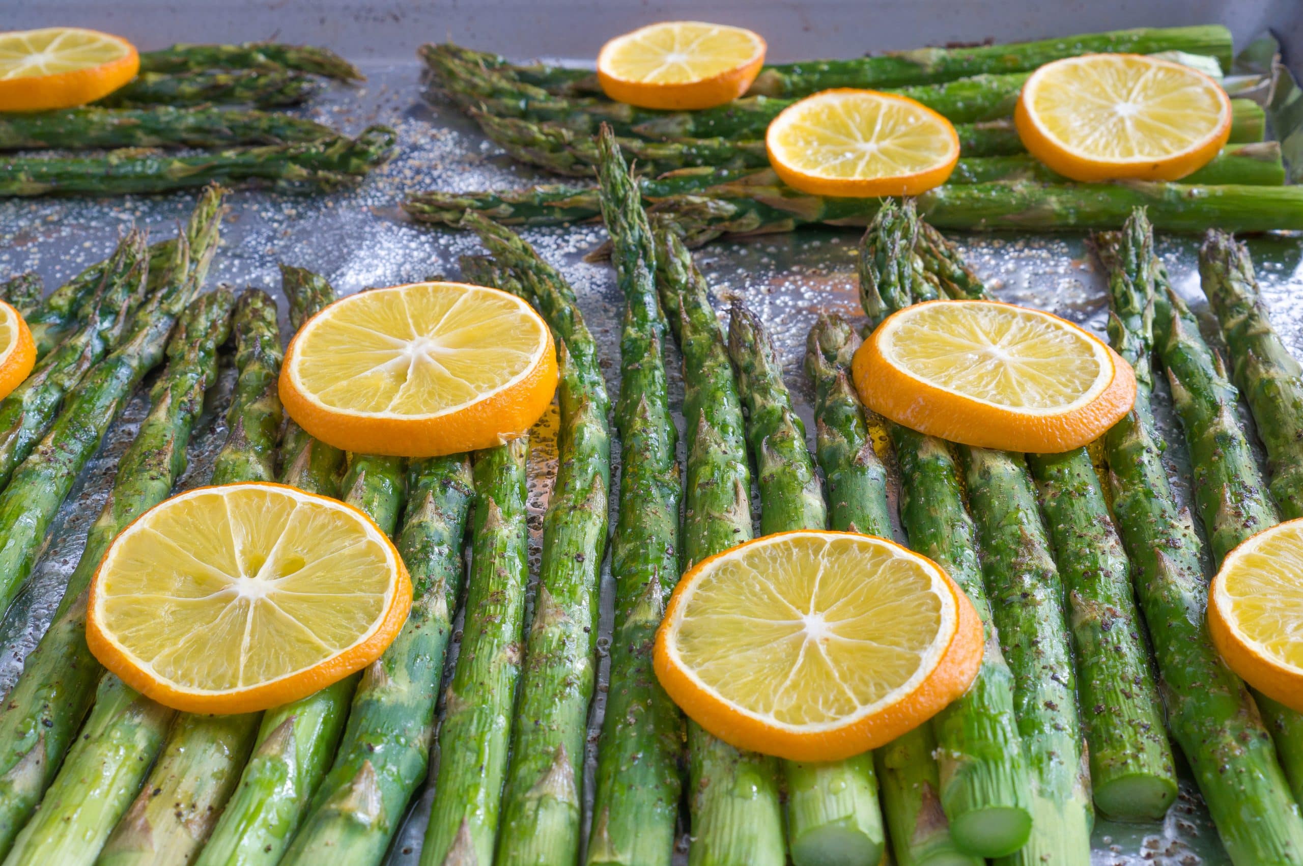 Baked Lemon Pepper Asparagus – Simple recipe for Baked Lemon Pepper Asparagus using fresh asparagus, extra virgin olive oil, salt, pepper, and fresh lemon slices. All you need is a hot oven, 5 ingredients, a sheet pan, and 20 minutes. We love making this part of our healthy weekly meal prep! Gluten free, vegan, & paleo-friendly. ♥ | freeyourfork.com