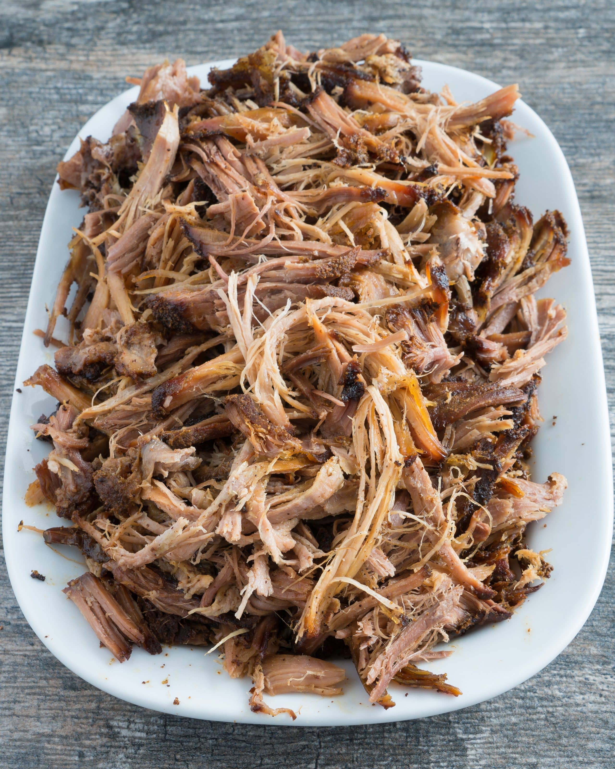 Crispy Crockpot Carnitas – Easy recipe for homemade Crispy Crockpot Carnitas. Gluten-free and paleo-friendly! Perfect for tacos, burritos, nachos, enchiladas, sandwiches, and more! Just combine pork shoulder with a simple dry-rub & a squeeze of citrus, then let your slow cooker do the rest. We love this on top of eggs for a quick, savory breakfast! ♥ | freeyourfork.com