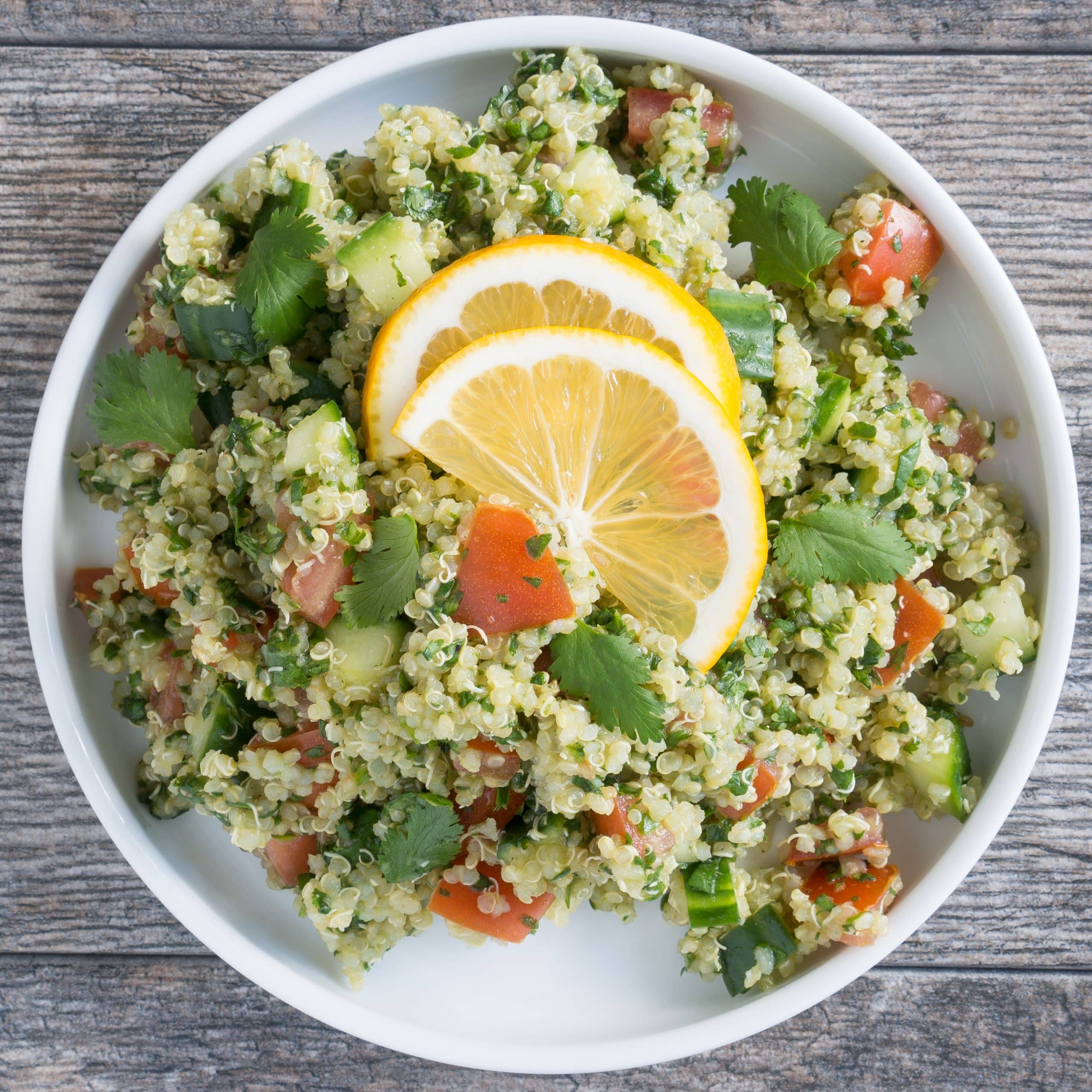 Quinoa Tabbouleh Salad – This Quinoa Tabbouleh Salad is a gluten-free version of the traditional bulgur wheat recipe. This salad has a light lemon & olive oil dressing. Plus it’s packed with chopped spinach, fresh parsley, crisp cucumber, tomato, and quinoa! ♥ | freeyourfork.com