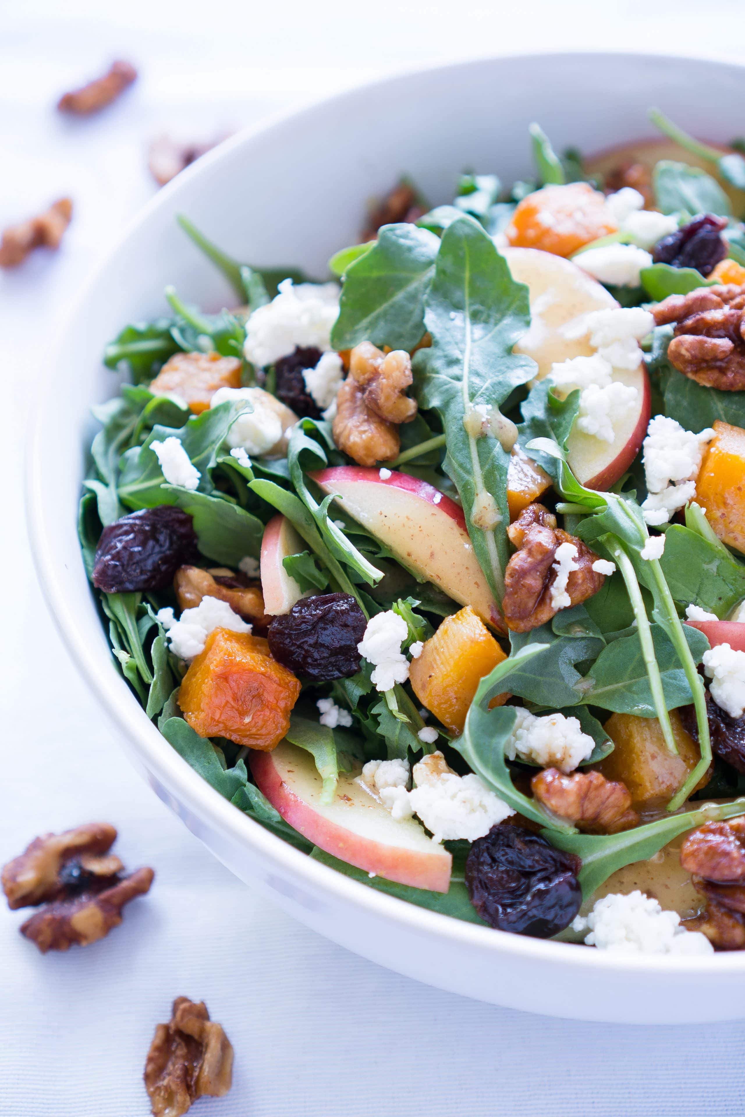 Roasted Butternut Squash Salad - Healthy recipe for Roasted Butternut Squash Salad with arugula! Paired with fresh apple, dried tart cherries, goat cheese, candied walnuts, & a homemade maple vinaigrette ♥ | freeyourfork.com 