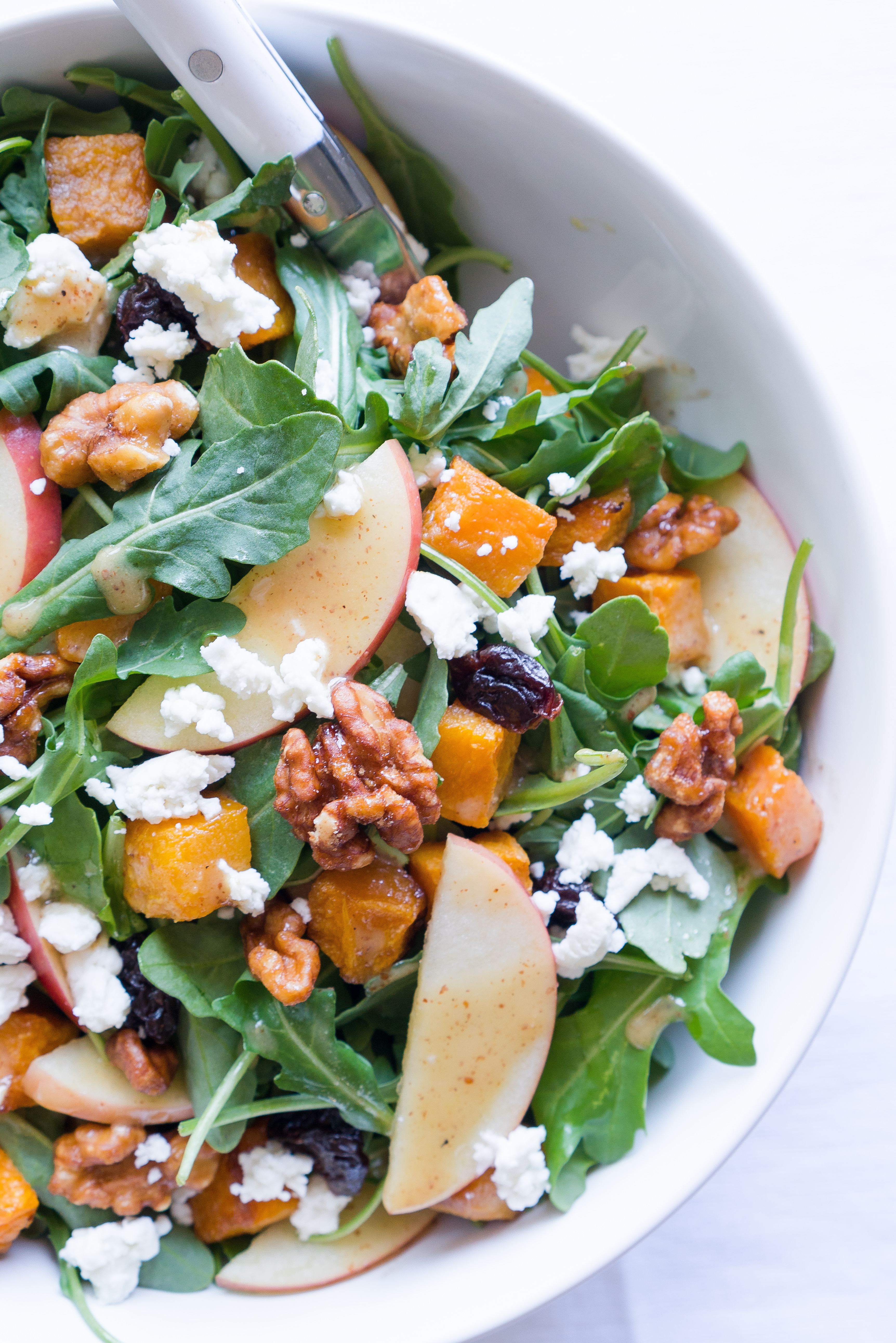 Roasted Butternut Squash Salad - Healthy recipe for Roasted Butternut Squash Salad with arugula! Paired with fresh apple, dried tart cherries, goat cheese, candied walnuts, & a homemade maple vinaigrette ♥ | freeyourfork.com 