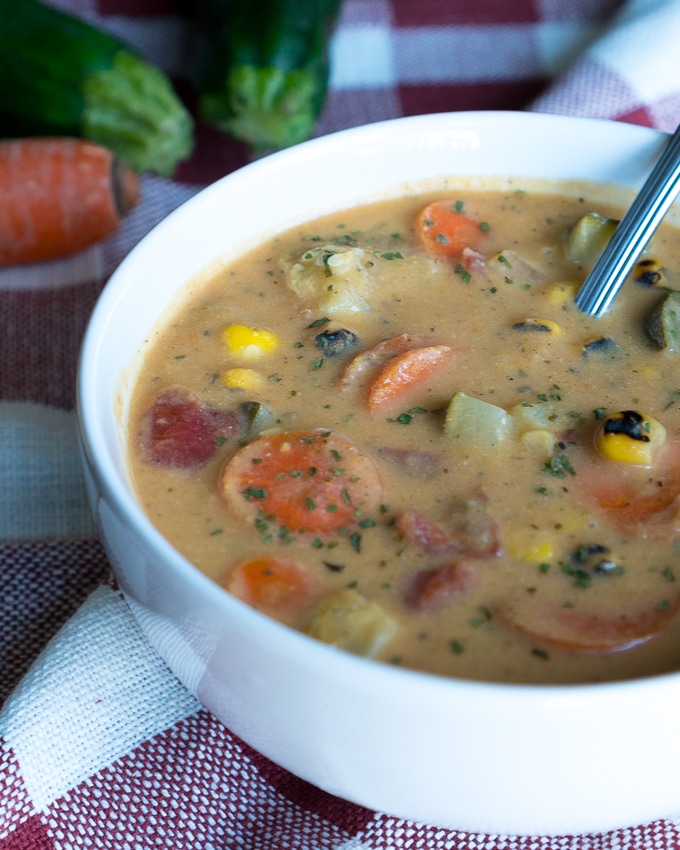 Creamy Vegetable Soup – Healthy recipe for Creamy Vegetable Soup! Uses zucchini, broccoli stalks, carrots, corn, tomatoes, and more. We love that this recipe is gluten-free, dairy-free, and potato-free with options to make it vegetarian/vegan friendly!♥ | freeyourfork.com