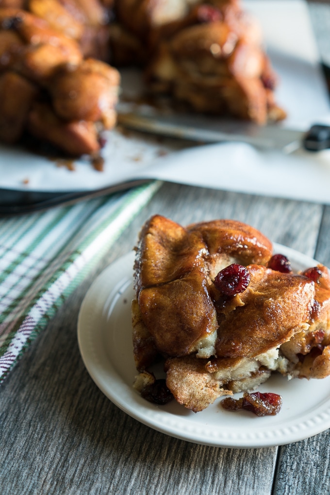Brie Stuffed Monkey Bread - Easy recipe for Brie Stuffed Monkey Bread! This semi-homemade dessert uses ready-to-bake biscuit dough, brie, cranberry sauce (or jam), dried cranberries, brown sugar, & spices. A fun & simple recipe to make with friends! ♥ | freeyourfork.com