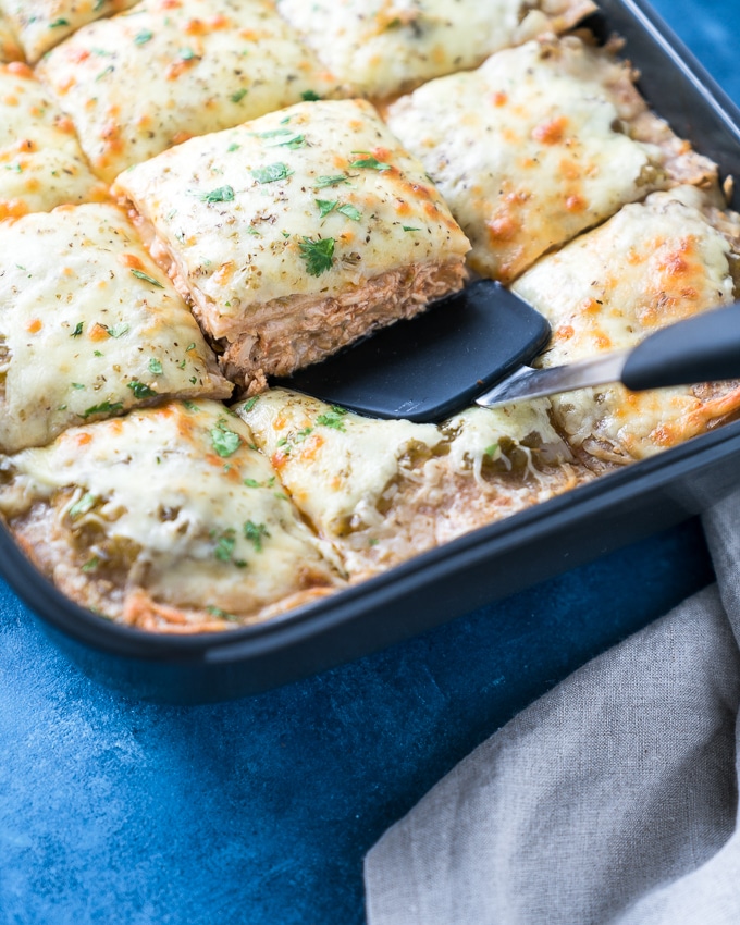 Green Chicken Enchilada Casserole - A healthy recipe for Green Chicken Enchilada Casserole! Baked in the oven with layers of soft tortillas, melty cheese, lean shredded chicken, white beans, salsa verde, and hatch chiles. Perfect for weekly meal-prep!! ♥ | freeyourfork.com