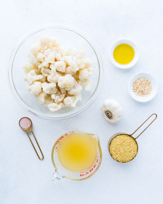 Creamy Cauliflower Soup - Healthy recipe using convenient frozen cauliflower, almond milk, roasted garlic, nutritional yeast, collagen peptides, and more. Dairy free and high protein (with recipe swaps to make it vegan friendly) ♥ | freeyourfork.com