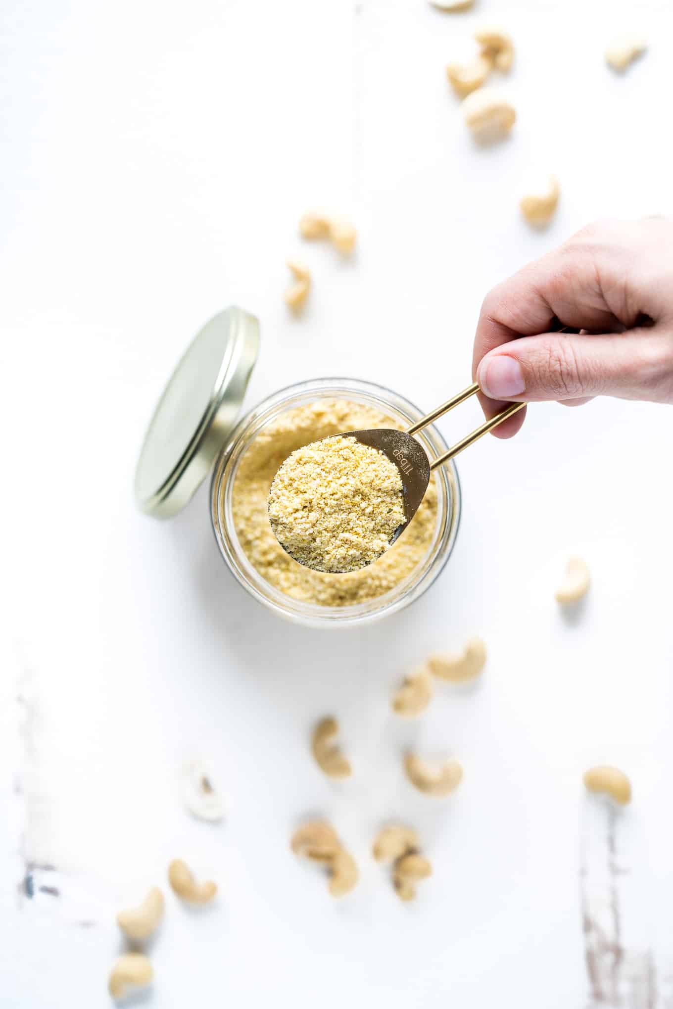 Vegan Parmesan Cheese Spoon Out of Jar