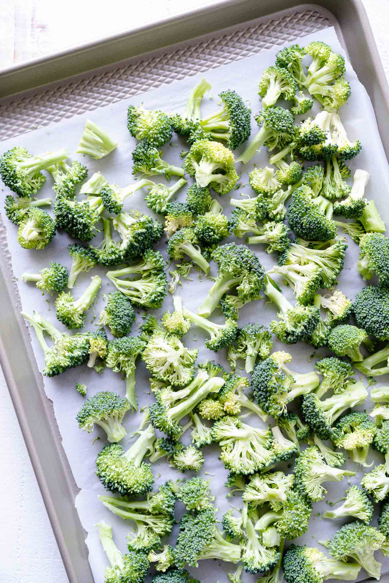 sheet tray with raw broccoli 