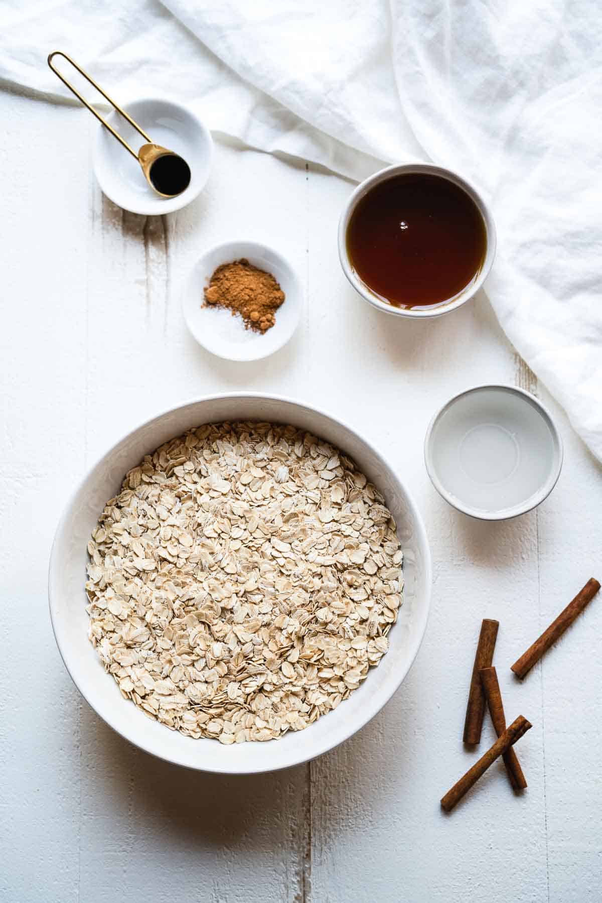 Ingredients for nut free granola on a white table.